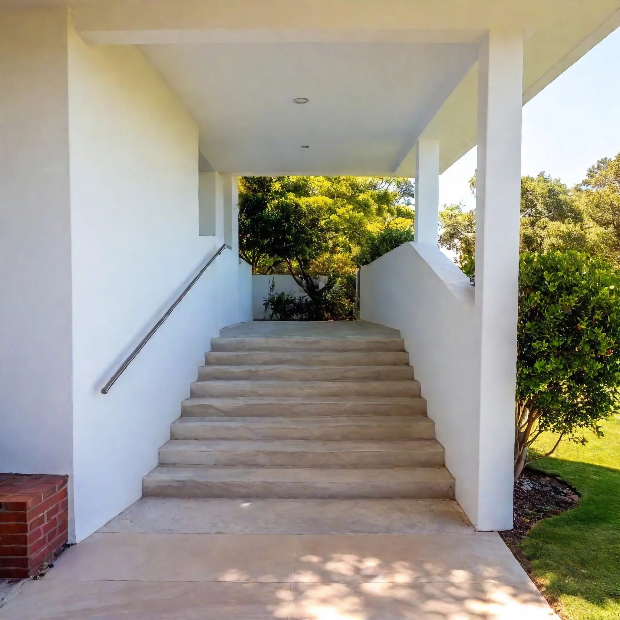 Concrete steps finished to match the surrounding paving