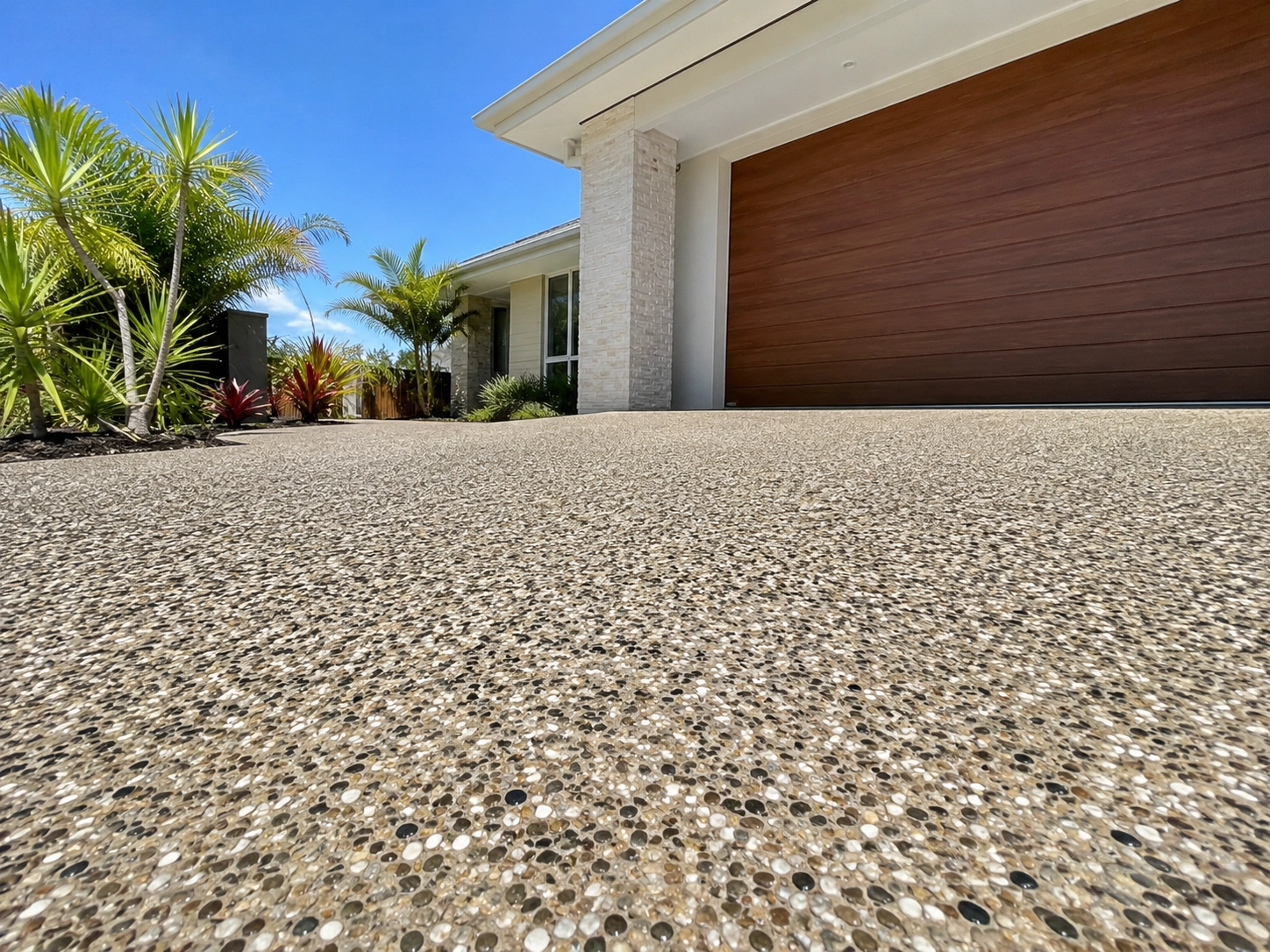 Concrete driveway with broom finish and garden edge