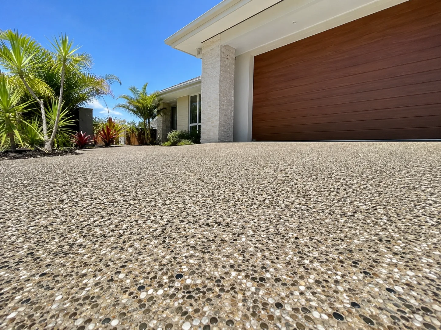Concrete driveway with broom finish and garden edge