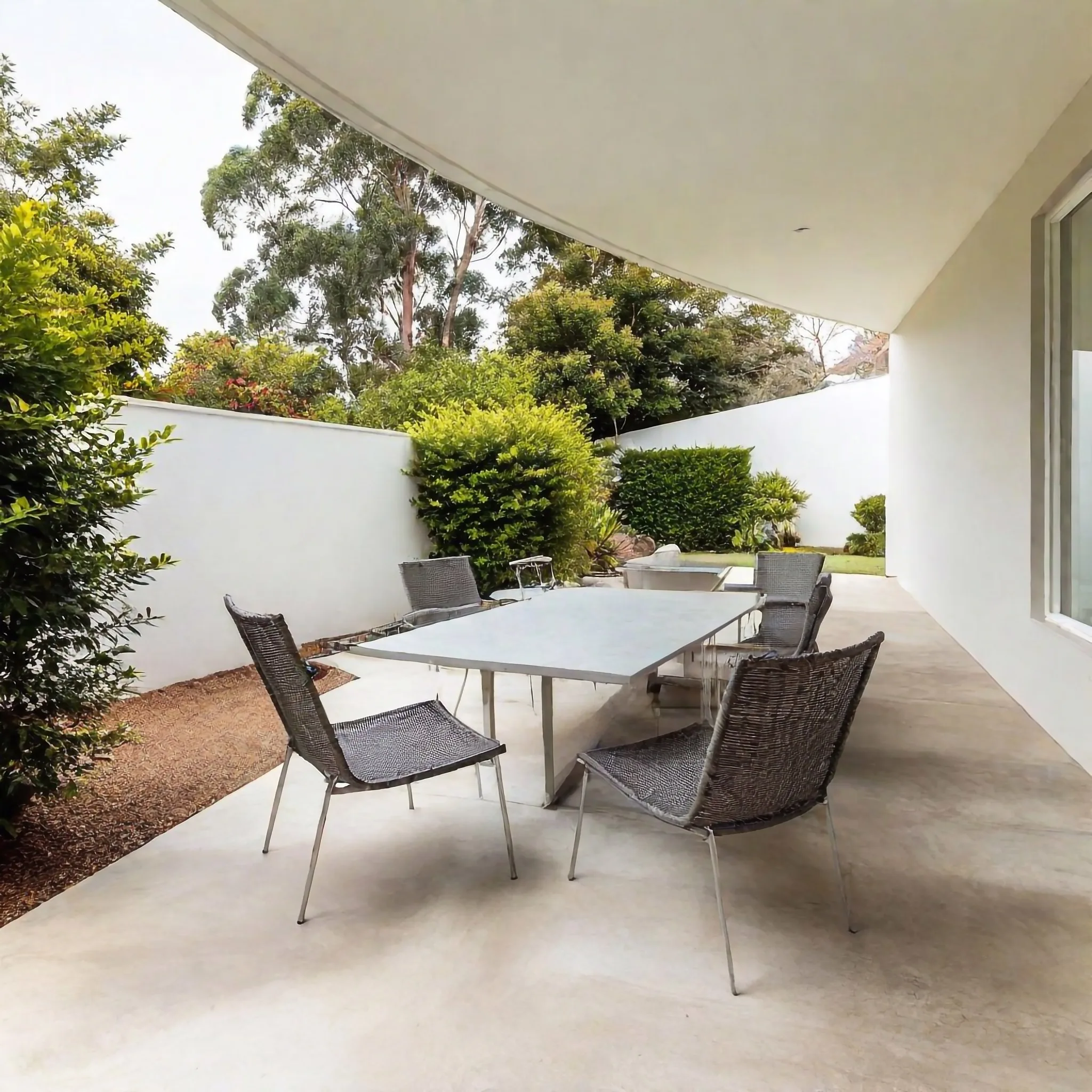 Concrete patio with plain finish and garden edge