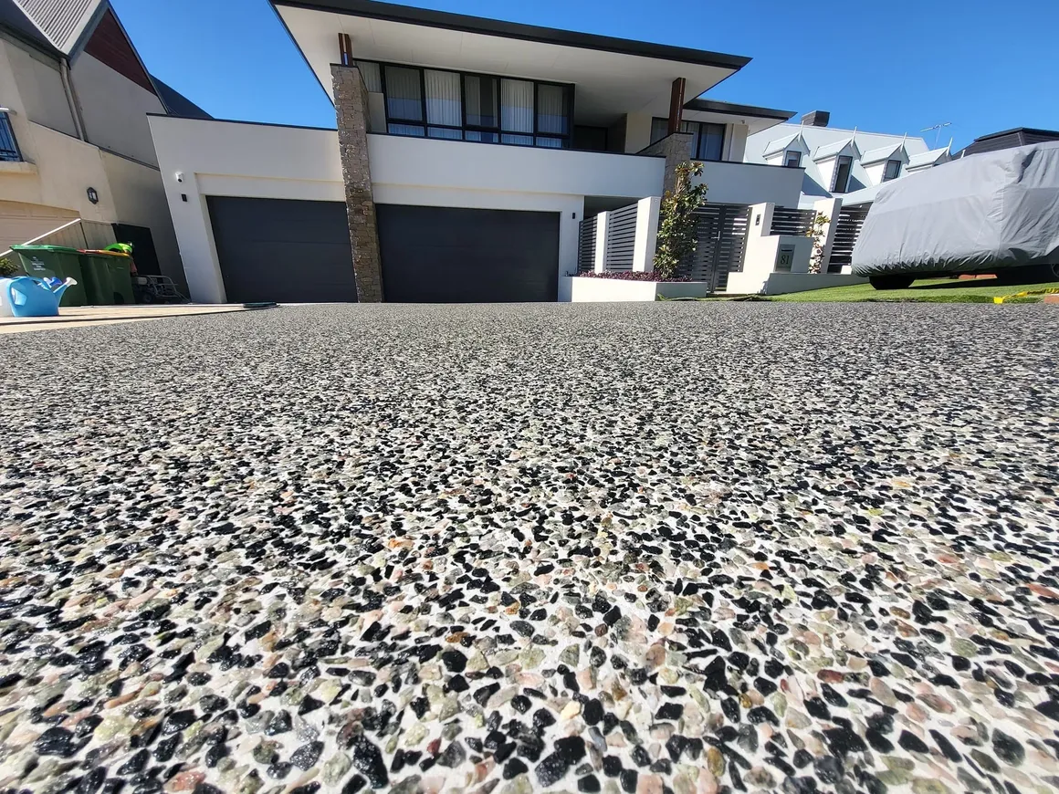 Close-up of exposed aggregate concrete finish showing stone texture